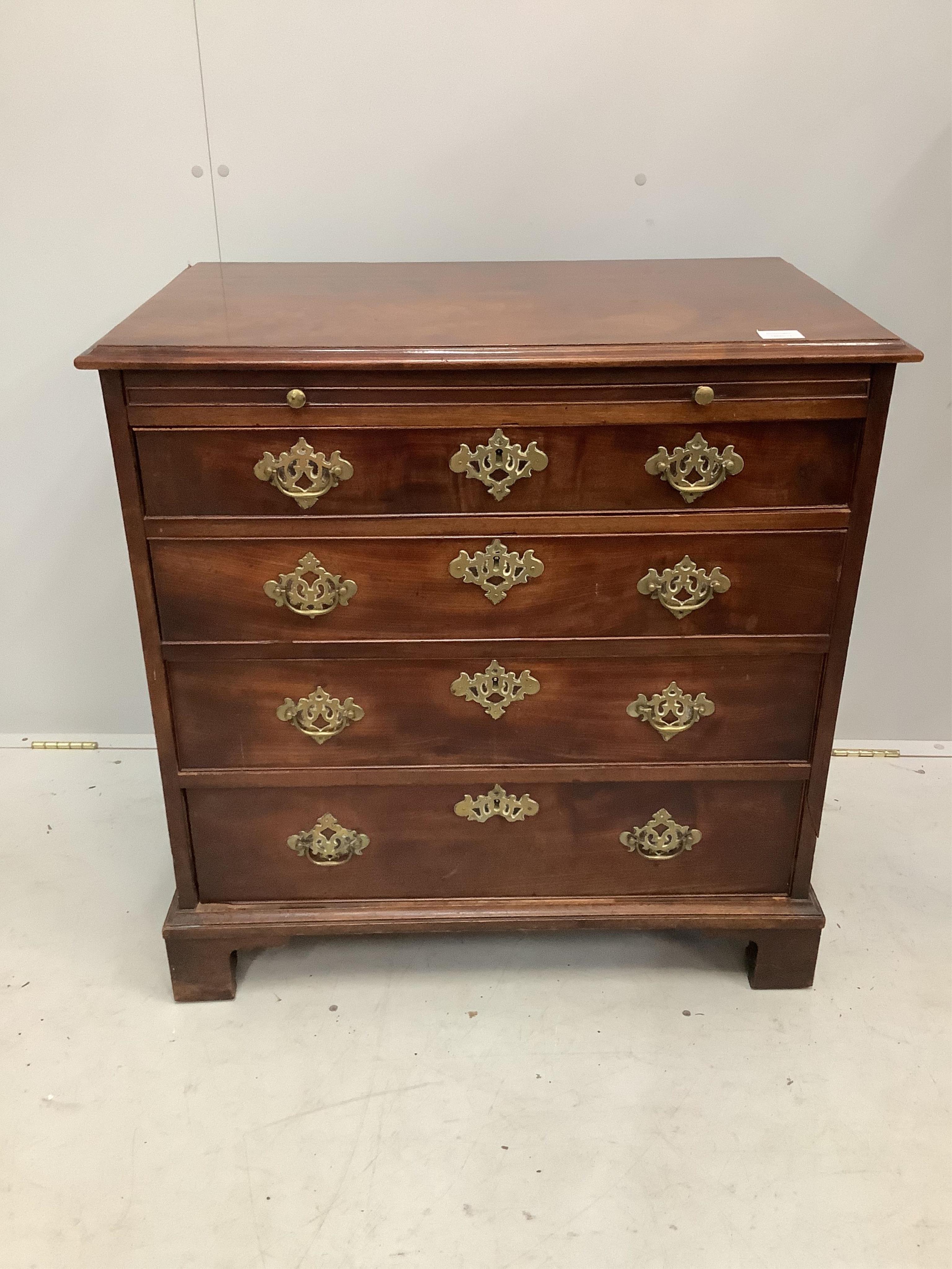 A small George III mahogany chest, fitted four long drawers, beneath a brushing slide, width 80cm, depth 49cm, height 81cm. Condition - fair